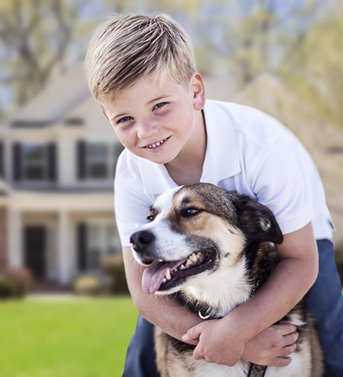 A young boy with his dog